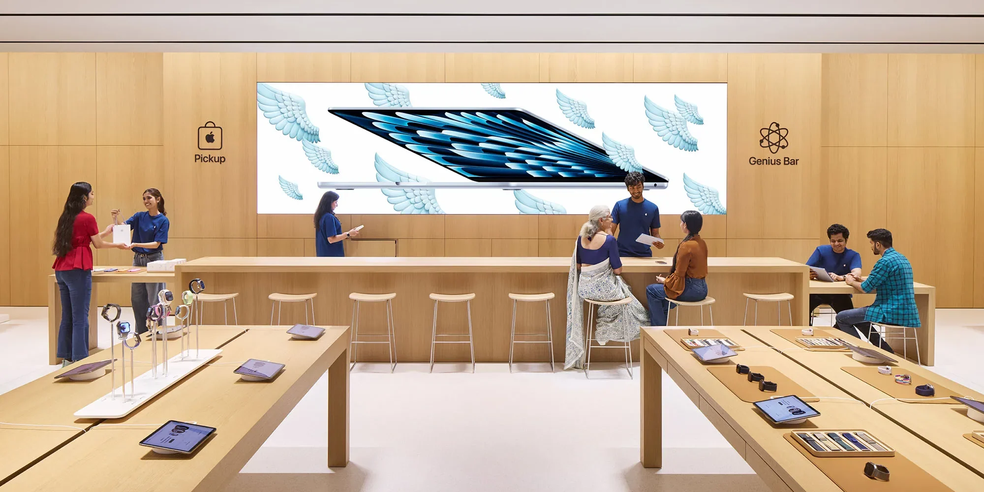 Apple Pickup and Genius Bar counter with MacBook Air campaign signage
