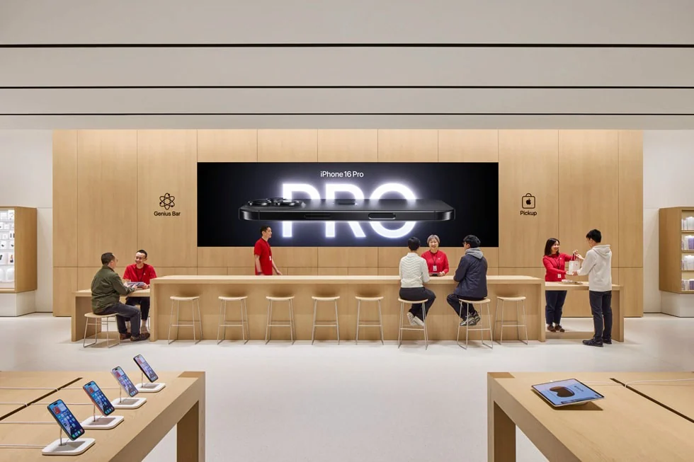 Apple retail interior with a large product display